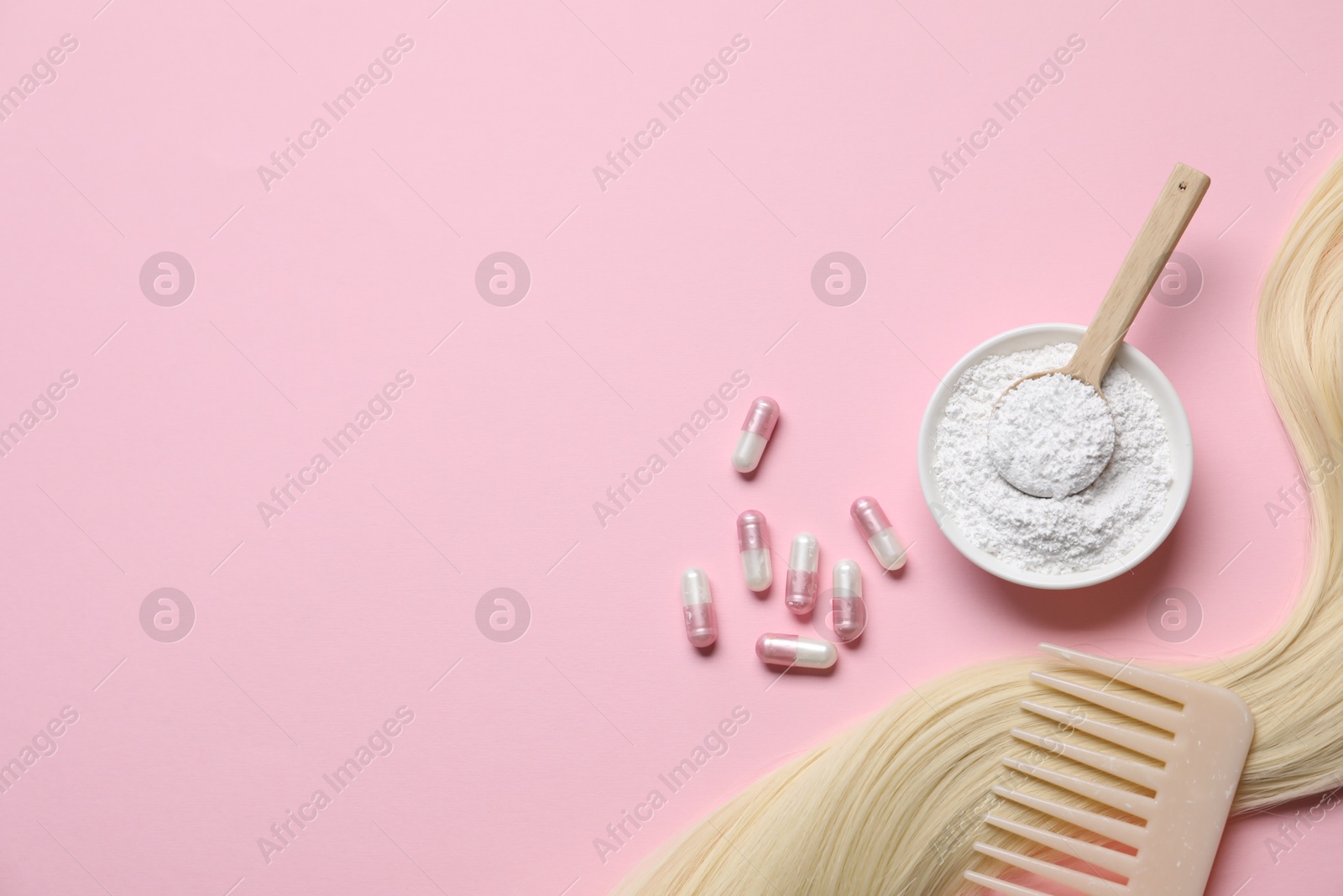 Collagen capsules, hair lock, powder and comb on pink background, flat lay. Space for text Photo of Collagen capsules, hair lock, powder and comb on pink background, flat lay. Space for text