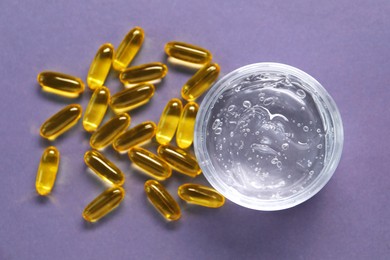 Photo of Collagen capsules and gel on violet background, flat lay