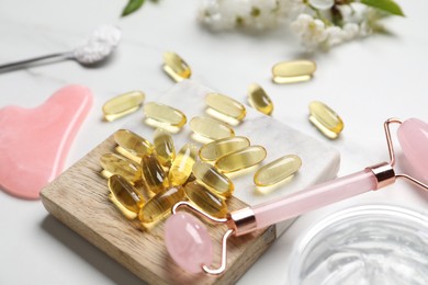 Photo of Composition with collagen capsules on white table, closeup