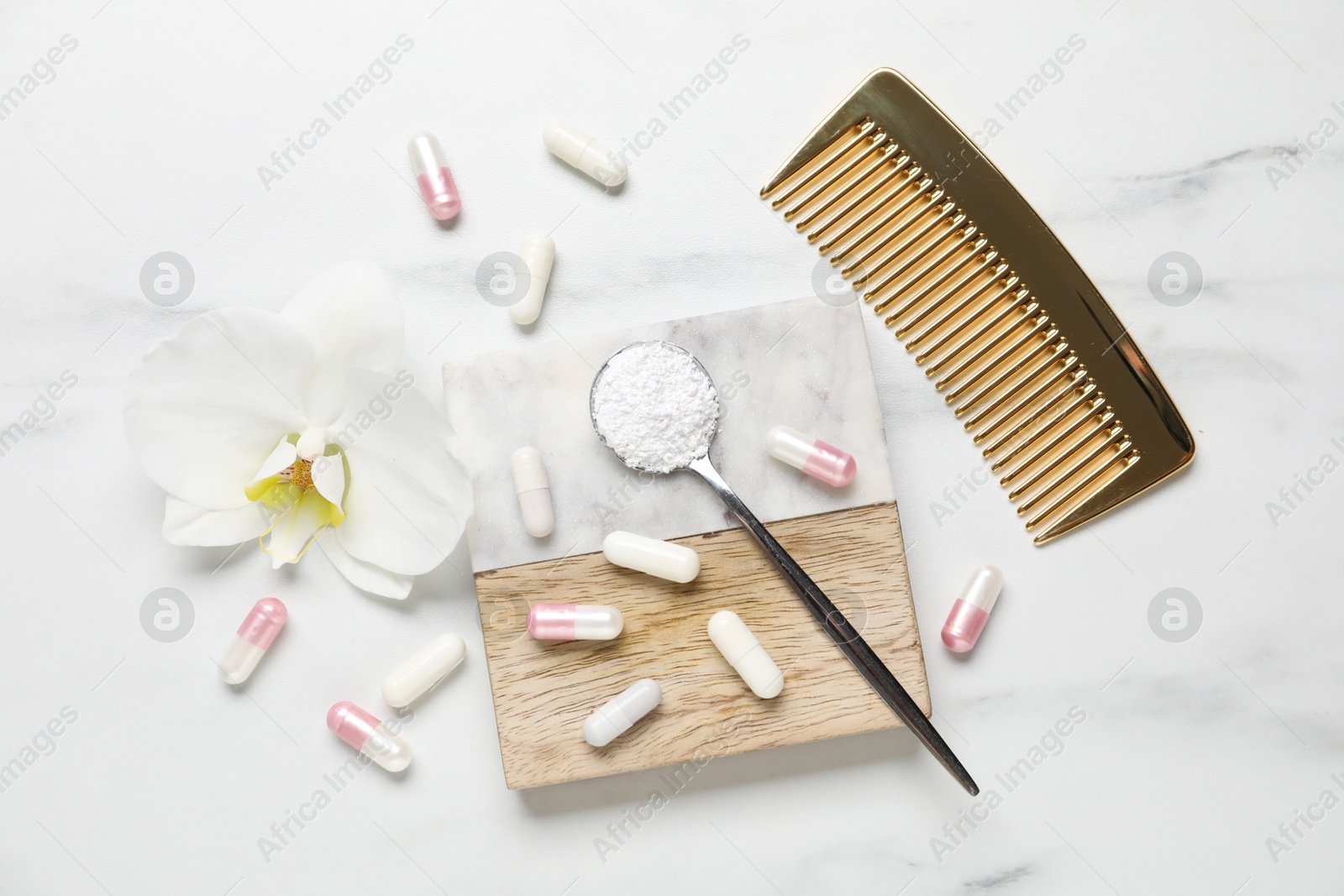 Collagen capsules, powder, comb and flower on white marble table, flat lay Photo of Collagen capsules, powder, comb and flower on white marble table, flat lay