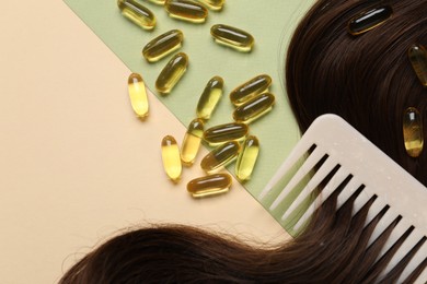 Photo of Collagen capsules, hair lock and comb on color background, flat lay. Space for text