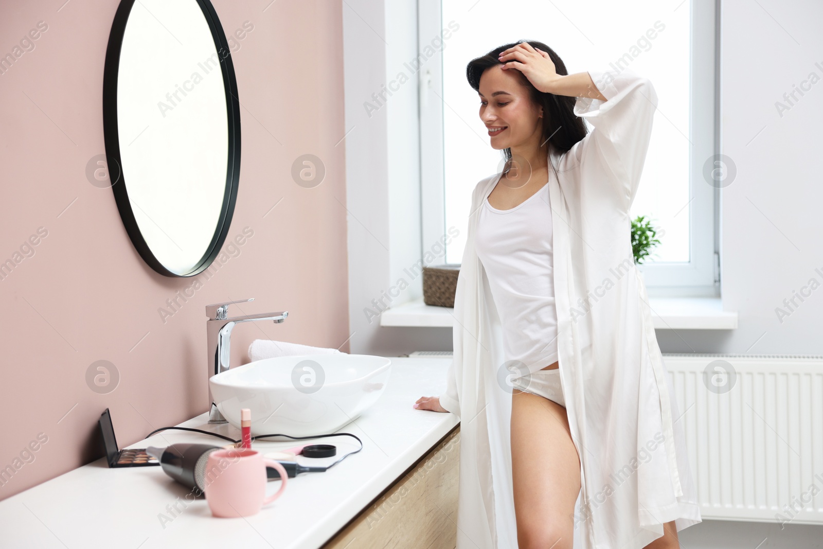 Attractive woman wearing beautiful underwear in bathroom Photo of Attractive woman wearing beautiful underwear in bathroom