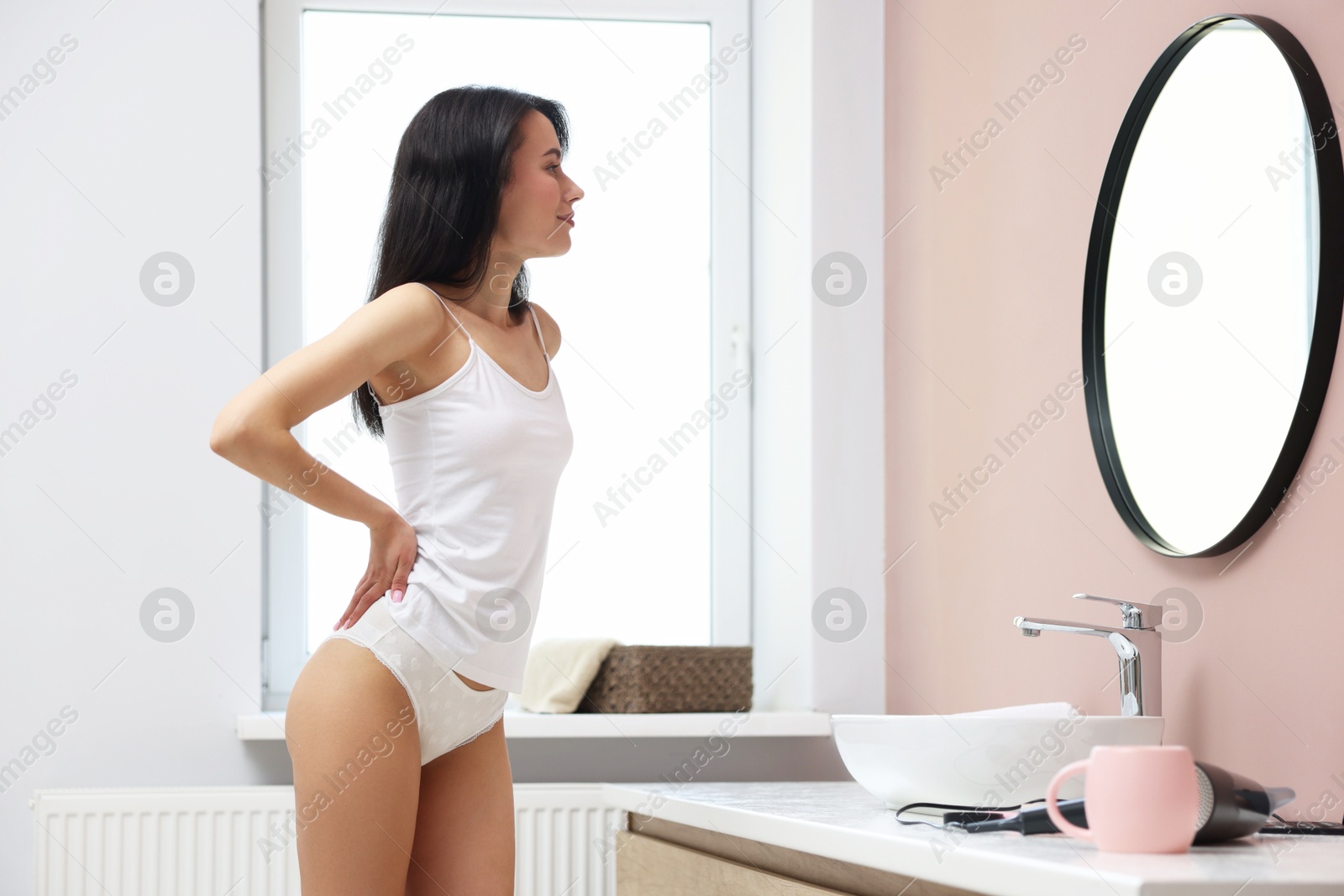 Attractive woman wearing beautiful underwear in bathroom Photo of Attractive woman wearing beautiful underwear in bathroom
