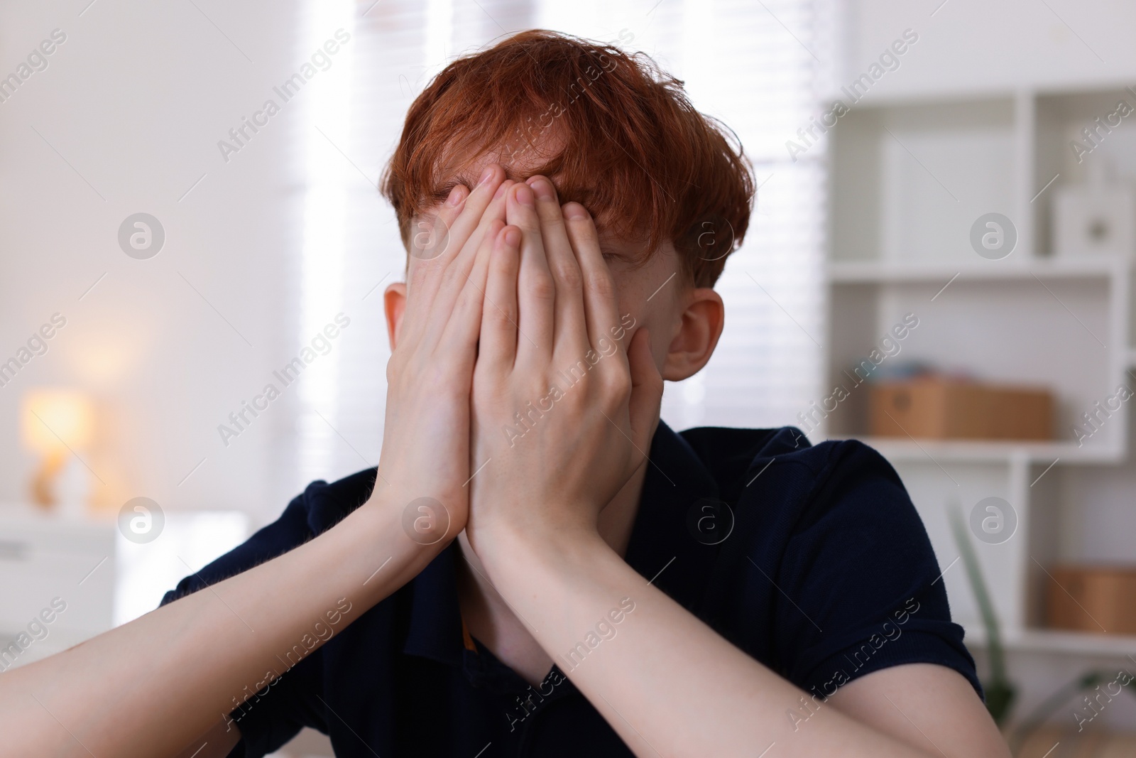 Teen problems. Depressed teenage boy at home Photo of Teen problems. Depressed teenage boy at home