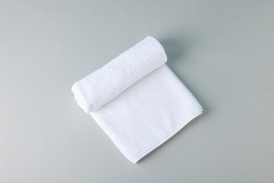 Photo of Clean towel on gray background, top view