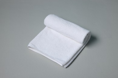 Photo of One clean terry towel on gray background