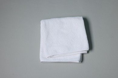 Photo of Clean towel on gray background, top view
