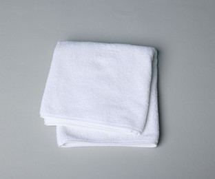 Photo of Clean towel on gray background, top view