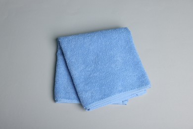 Photo of Clean towel on gray background, top view