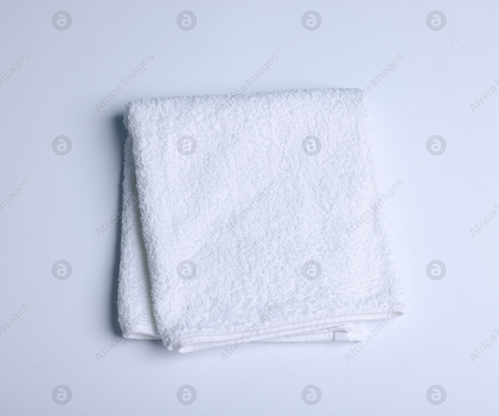 Clean towel on white background, top view Photo of Clean towel on white background, top view