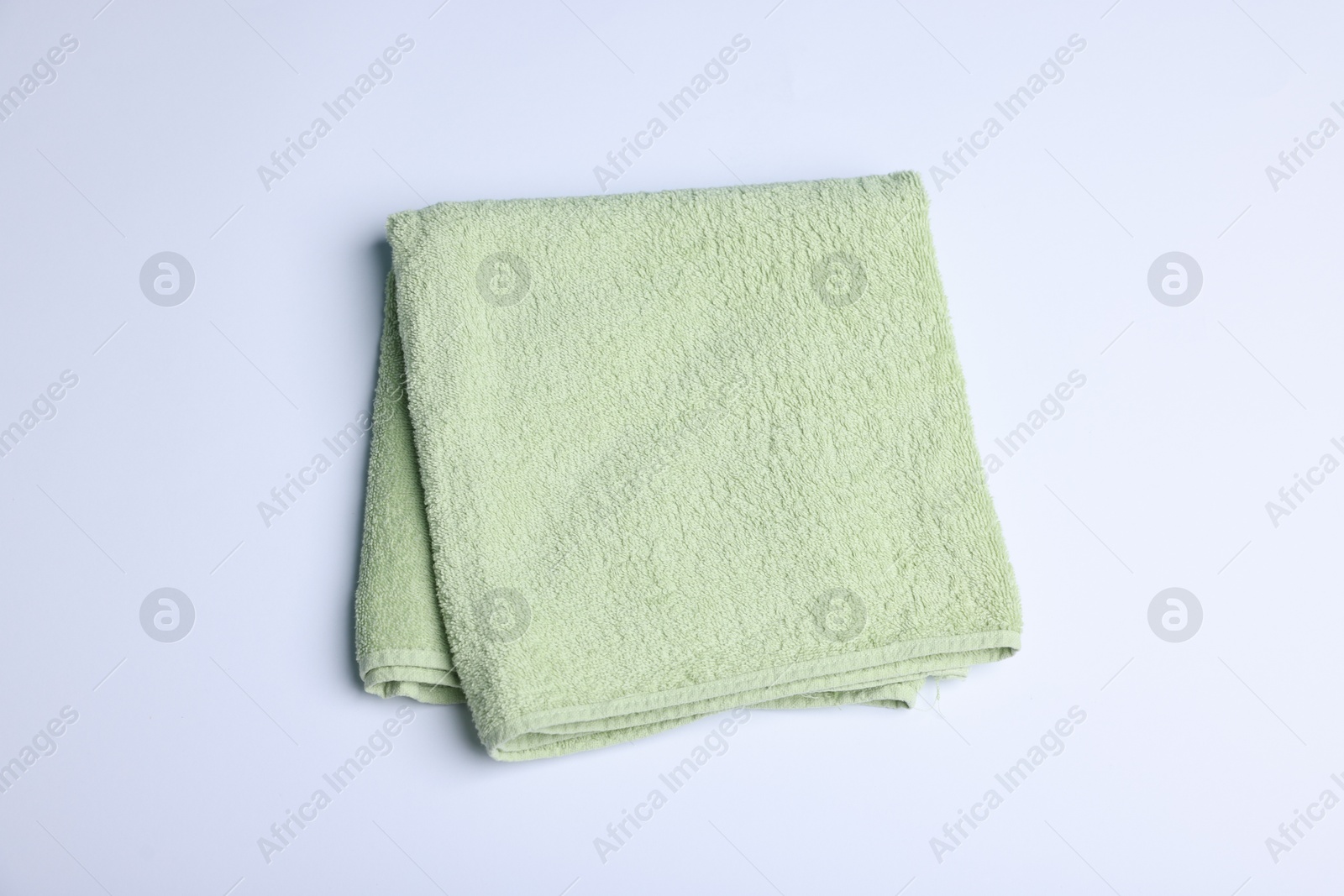 Clean towel on white background, above view Photo of Clean towel on white background, above view