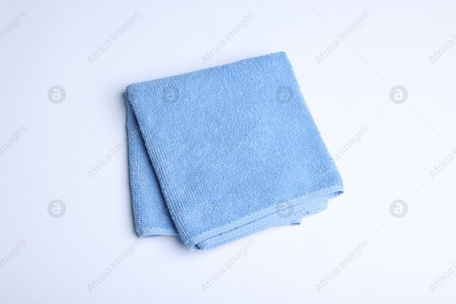 Clean towel on white background, above view Photo of Clean towel on white background, above view