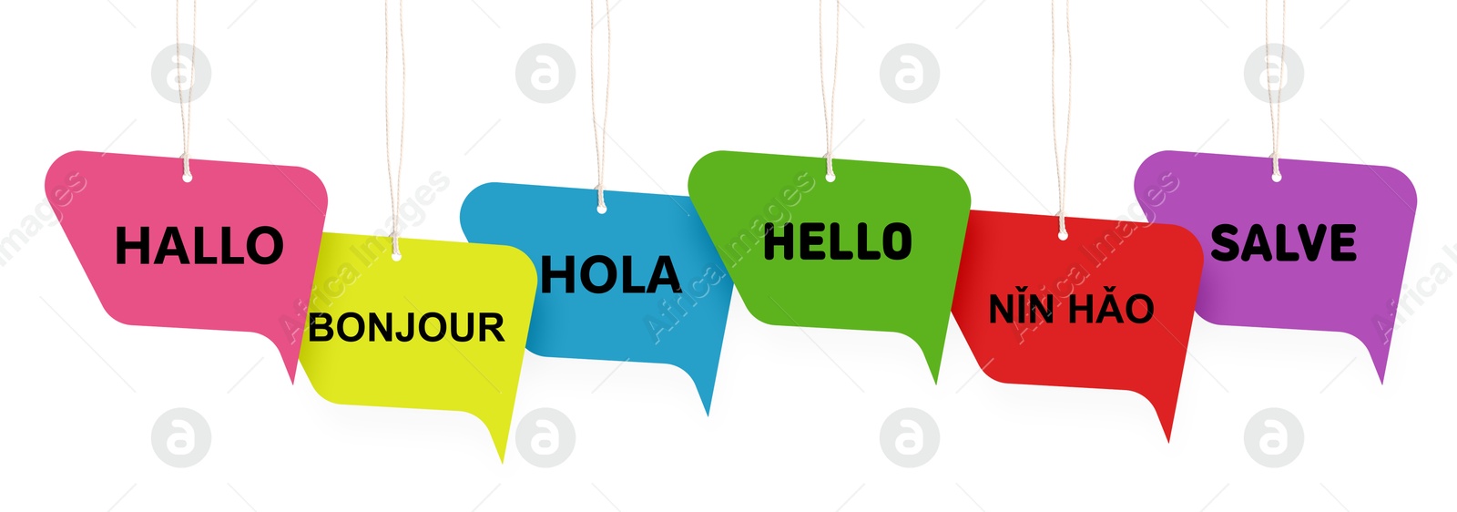 Paper speech bubbles with greetings in different languages hanging on white background. Banner design Image of Paper speech bubbles with greetings in different languages hanging on white background. Banner design
