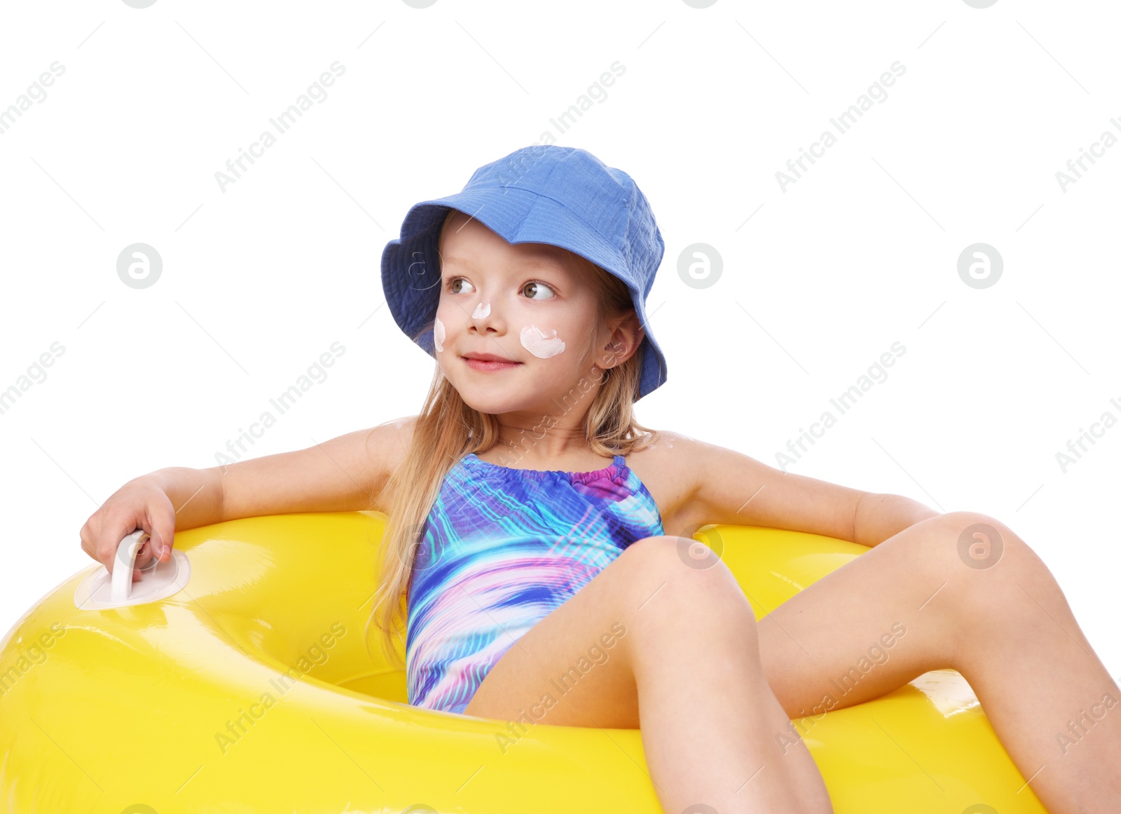 Cute little girl with sun protection cream on her skin and inflatable ring against white background Photo of Cute little girl with sun protection cream on her skin and inflatable ring against white background