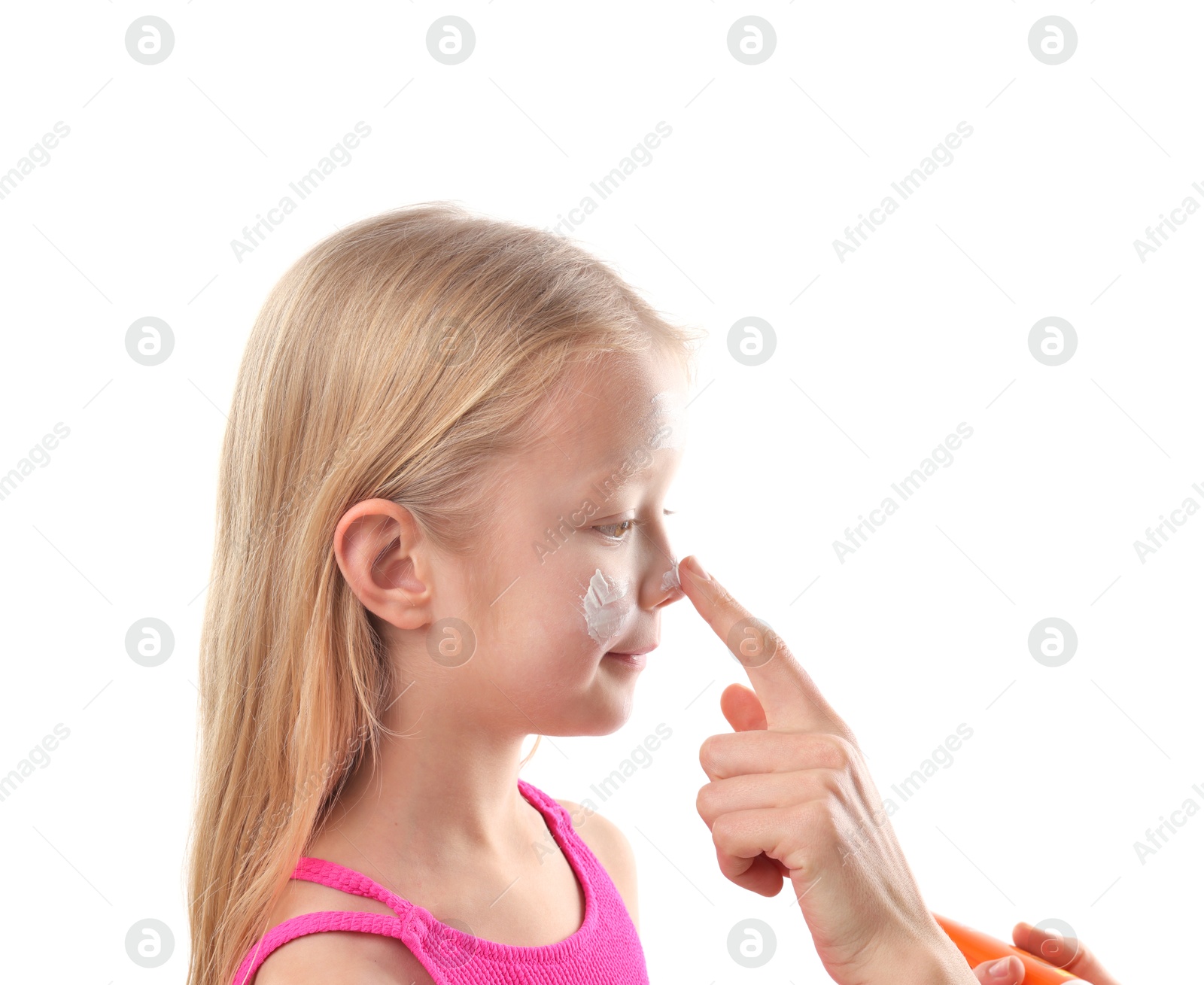 Mother applying sun protection product onto her daughter's nose on white background, closeup Photo of Mother applying sun protection product onto her daughter's nose on white background, closeup