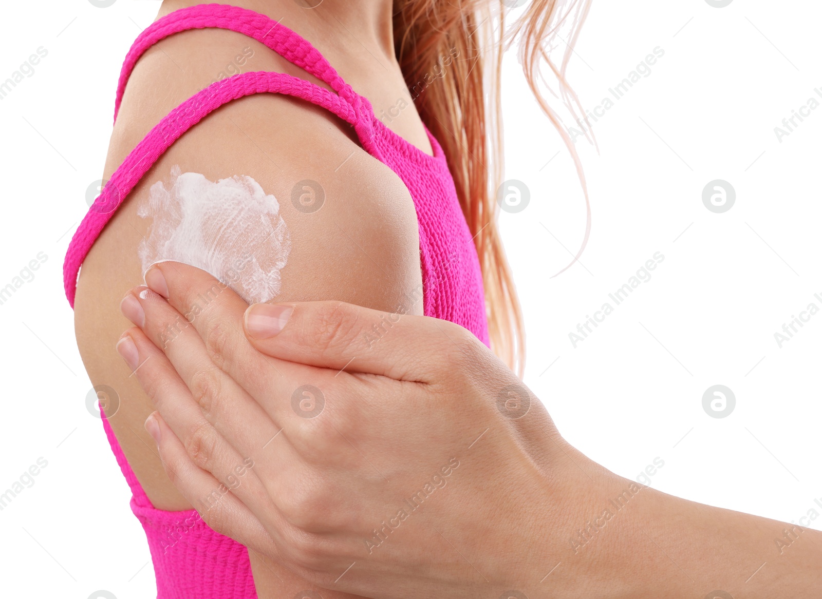 Mother applying sun protection product onto her daughter's skin on white background, closeup Photo of Mother applying sun protection product onto her daughter's skin on white background, closeup