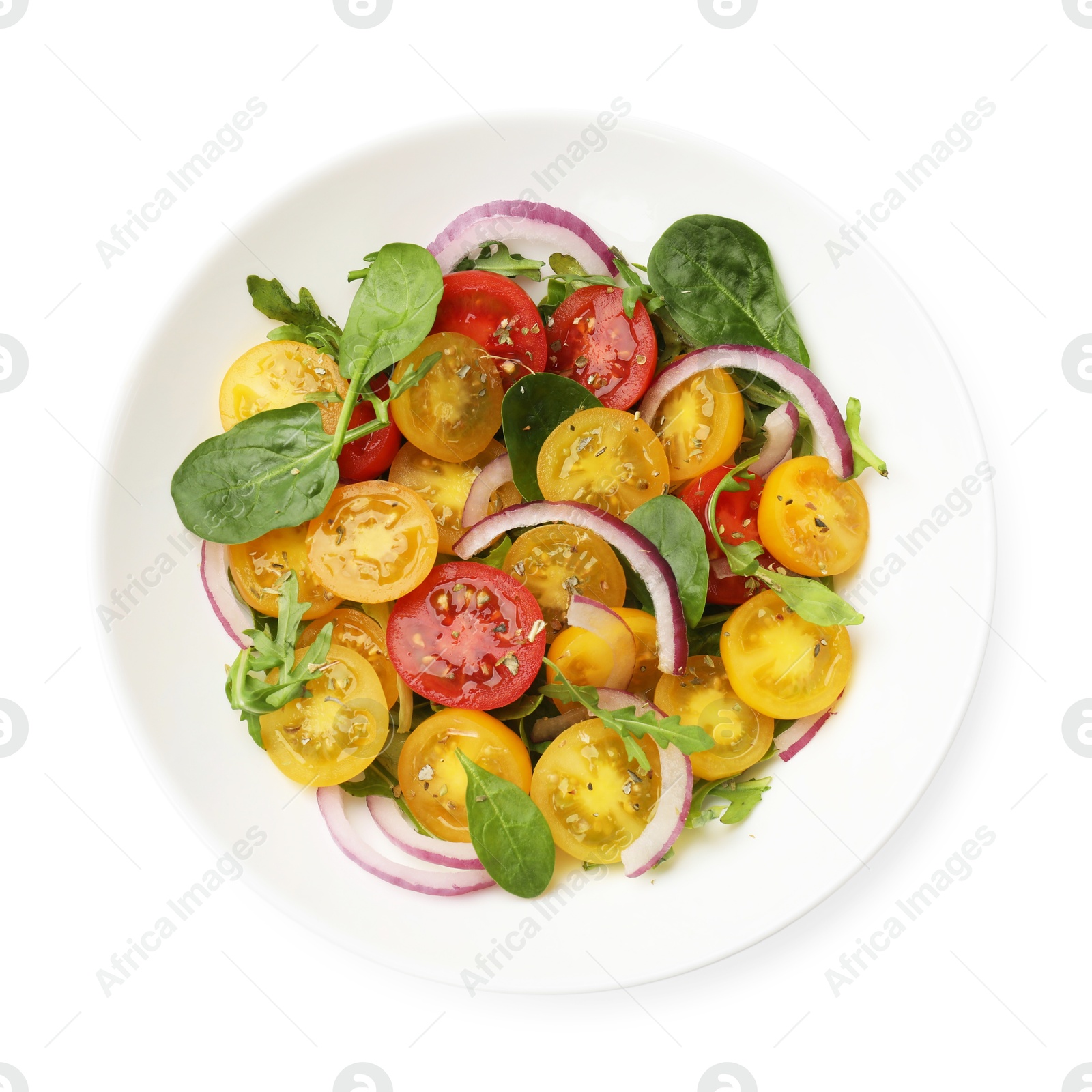 Fresh salad with yellow tomatoes isolated on white, top view Photo of Fresh salad with yellow tomatoes isolated on white, top view