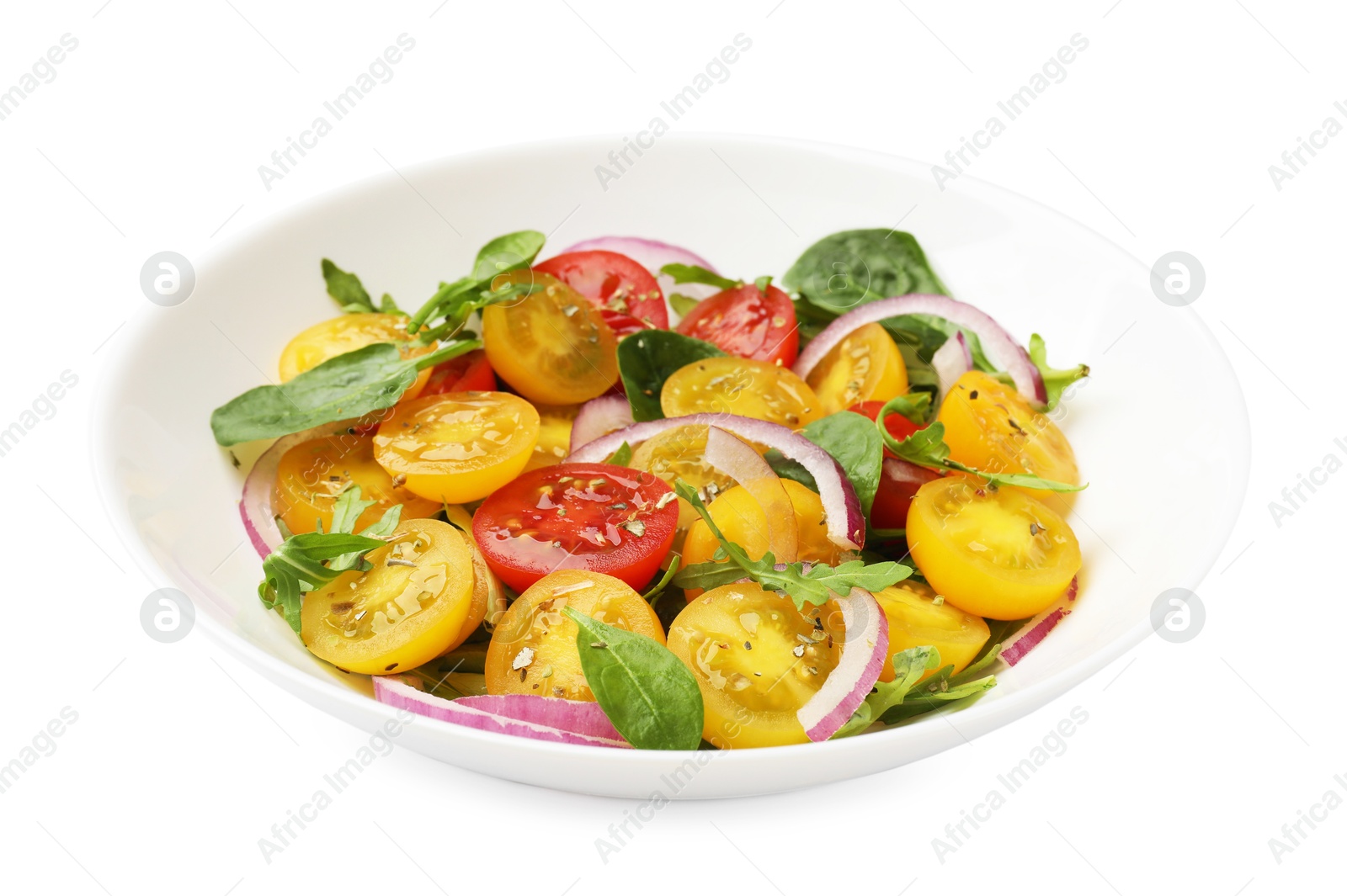 Fresh salad with yellow tomatoes isolated on white Photo of Fresh salad with yellow tomatoes isolated on white