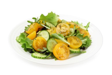 Photo of Fresh salad with yellow tomatoes isolated on white