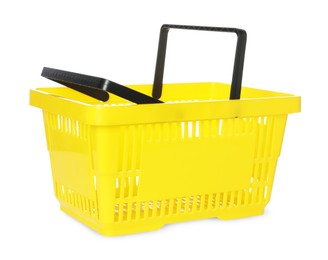 Photo of One yellow shopping basket isolated on white