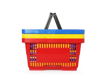 Photo of Stack of colorful shopping baskets isolated on white