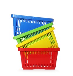Photo of Stack of colorful shopping baskets isolated on white