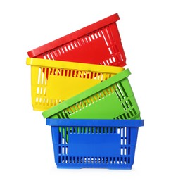 Photo of Stack of colorful shopping baskets isolated on white
