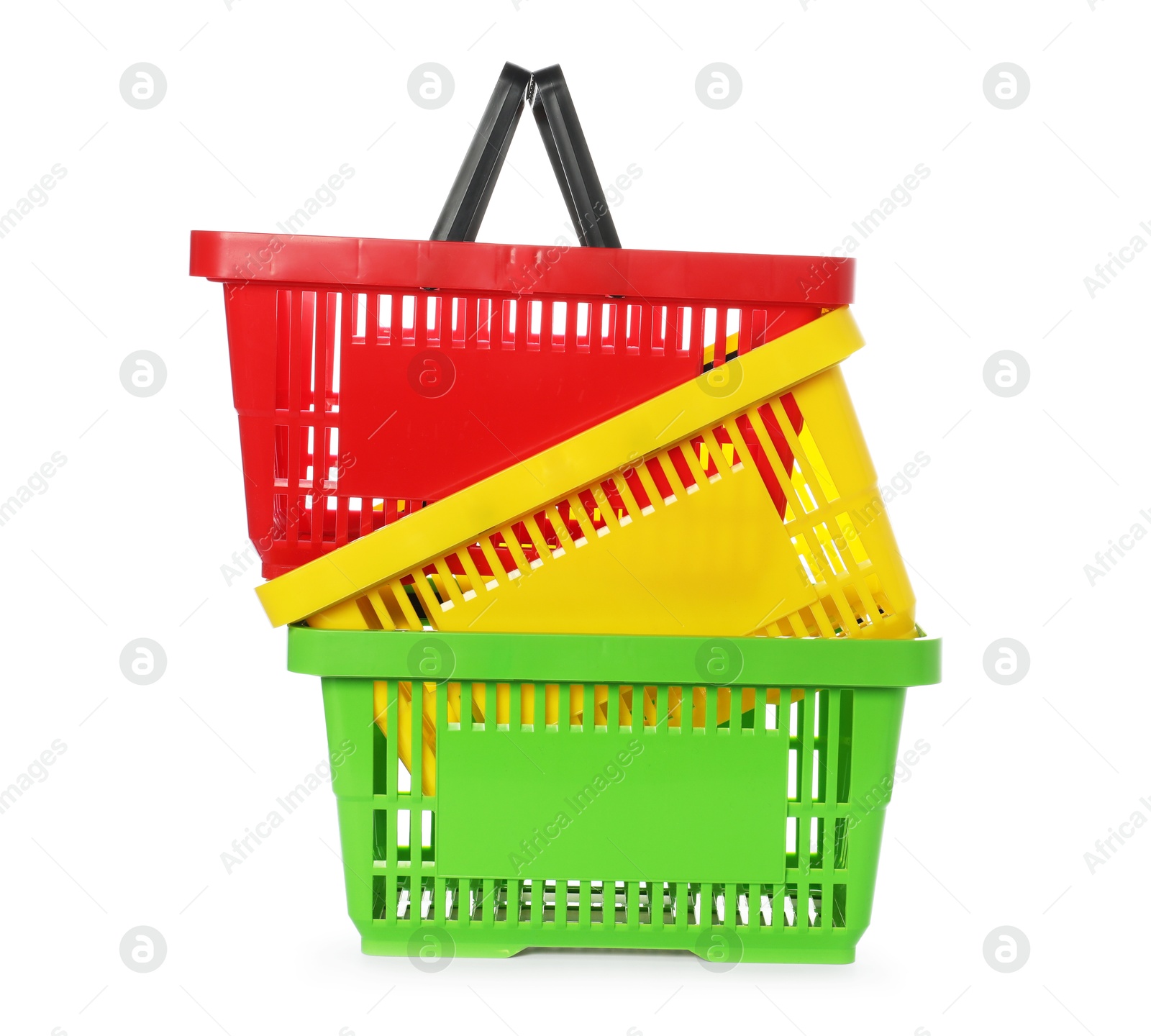 Stack of colorful shopping baskets isolated on white Photo of Stack of colorful shopping baskets isolated on white