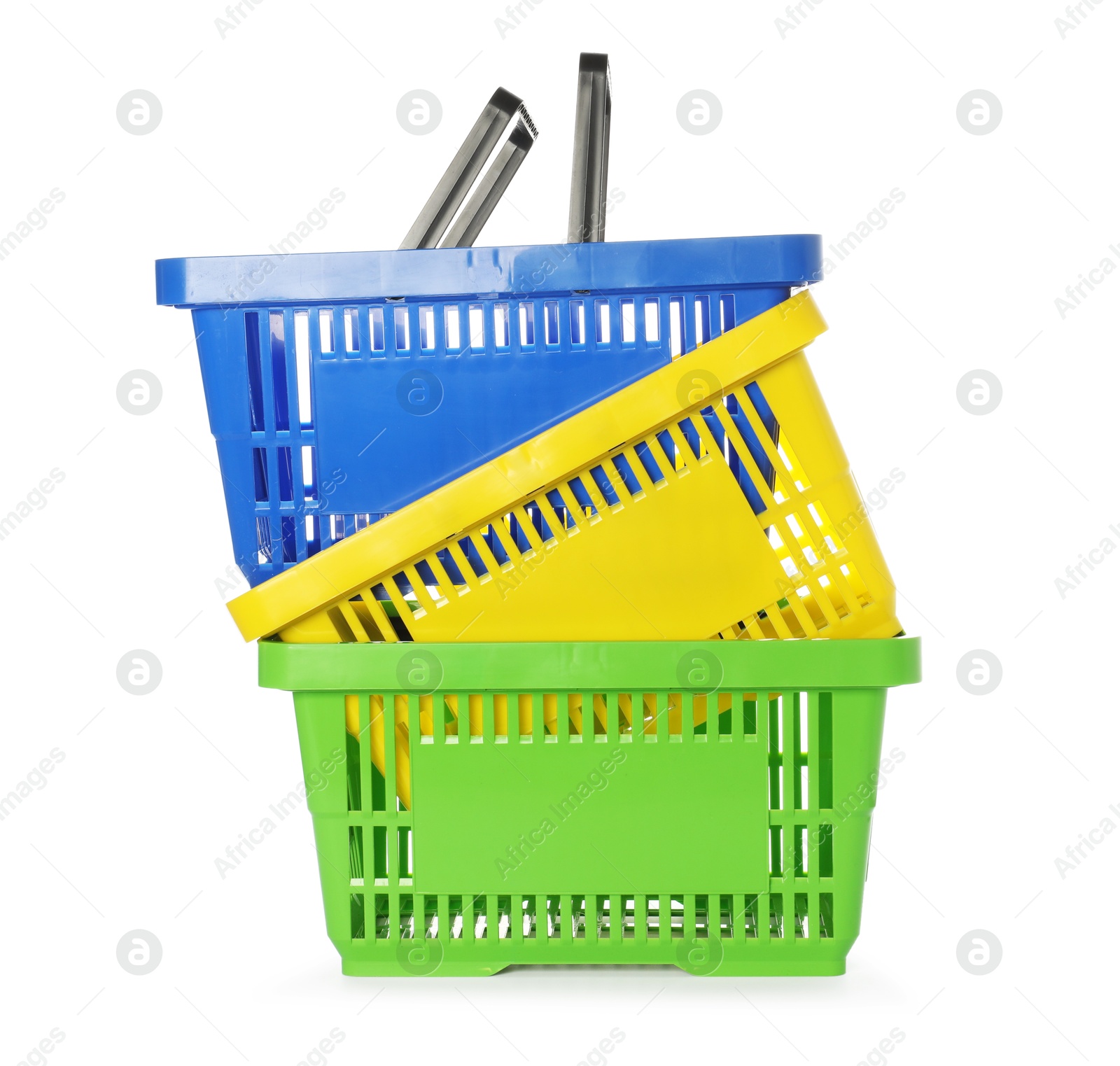 Stack of colorful shopping baskets isolated on white Photo of Stack of colorful shopping baskets isolated on white