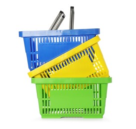 Photo of Stack of colorful shopping baskets isolated on white