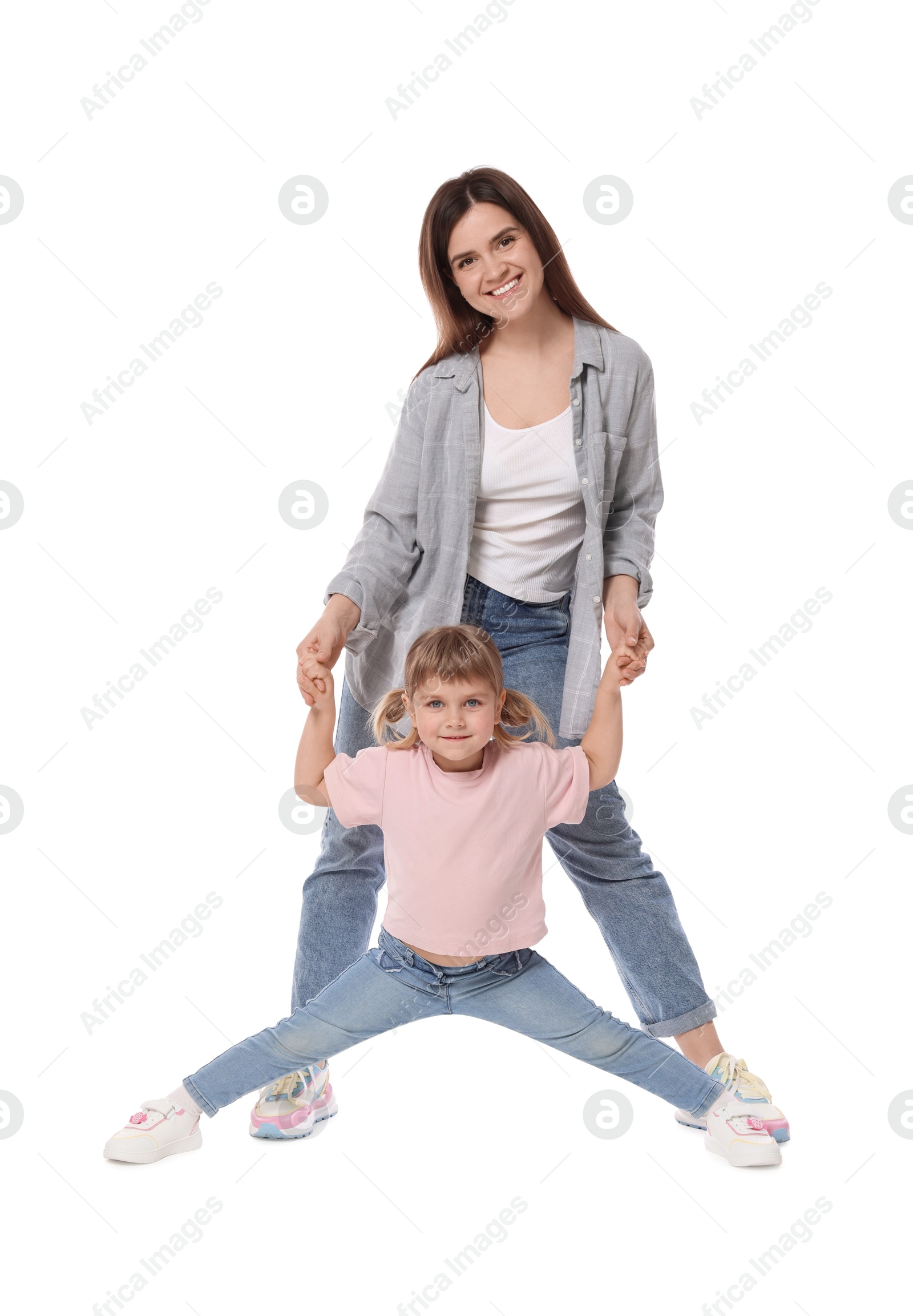 Happy mother and her cute daughter on white background Photo of Happy mother and her cute daughter on white background
