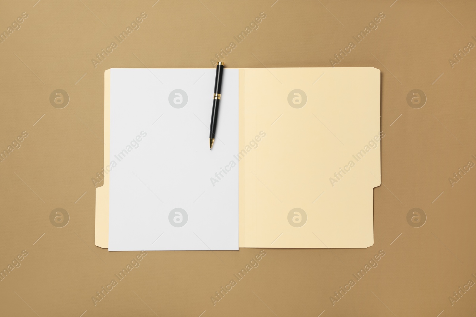 Paper file folder with blank sheet and pen on light brown background, top view Photo of Paper file folder with blank sheet and pen on light brown background, top view