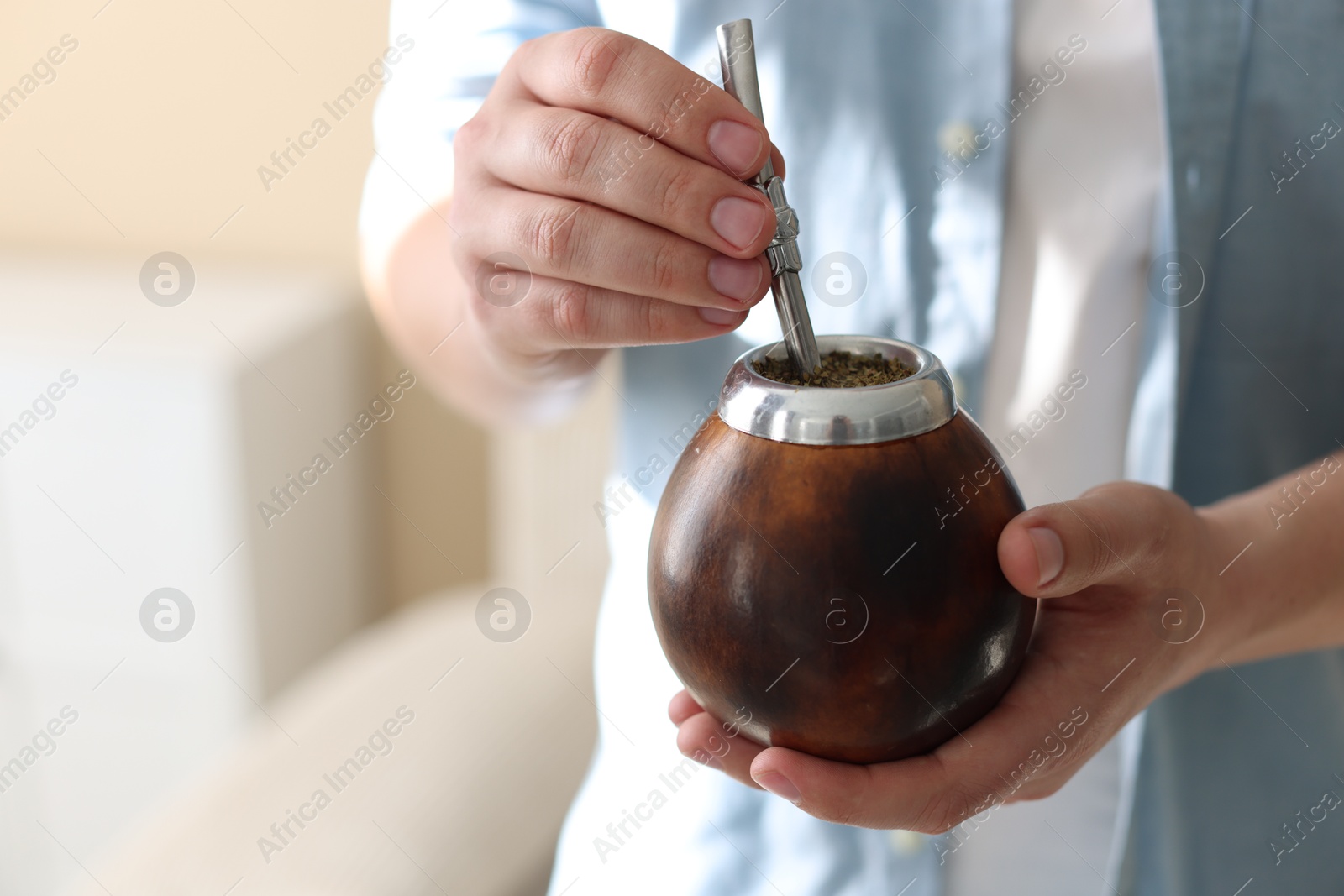 Man with traditional yerba mate tea at home, closeup Photo of Man with traditional yerba mate tea at home, closeup