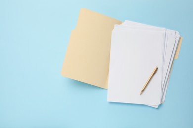 Photo of Paper file folder with blank sheets and pen on light blue background, top view. Space for text