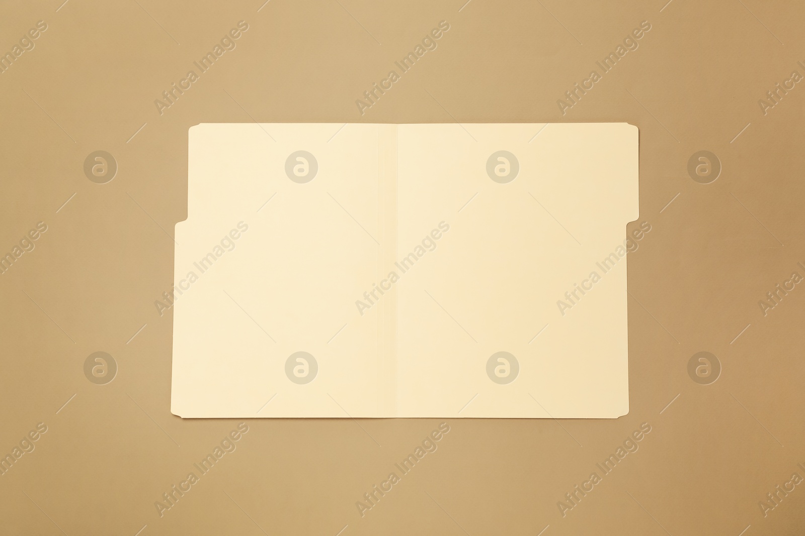 Paper file folder on light brown background, top view Photo of Paper file folder on light brown background, top view