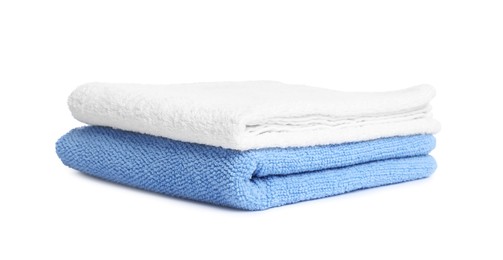 Photo of Two folded terry towels isolated on white