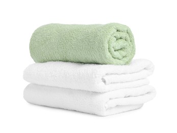 Photo of Many folded terry towels isolated on white