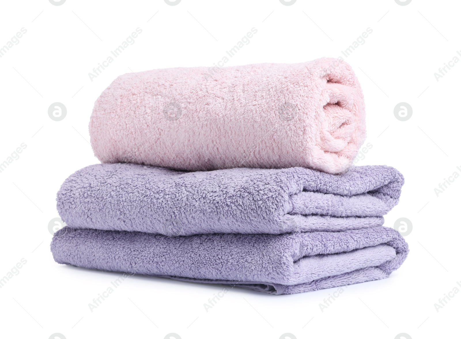 Many folded terry towels isolated on white Photo of Many folded terry towels isolated on white