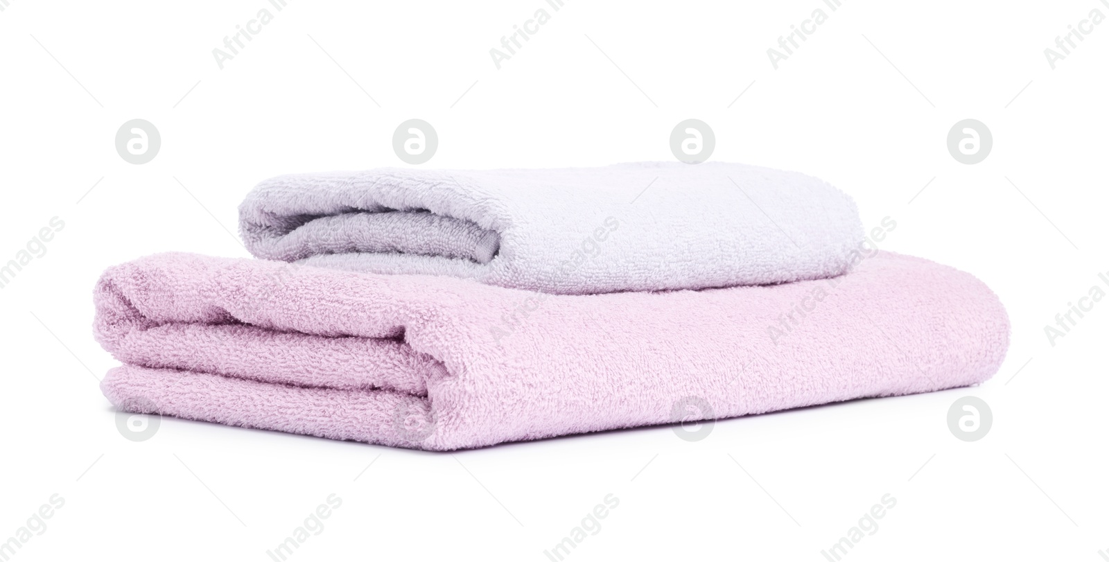 Two folded terry towels isolated on white Photo of Two folded terry towels isolated on white