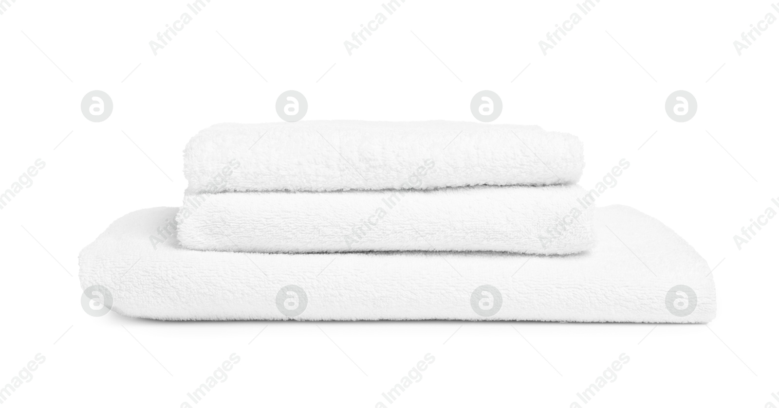 Stack of clean towels isolated on white Photo of Stack of clean towels isolated on white