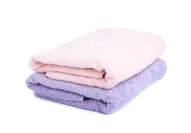 Photo of Two folded terry towels isolated on white