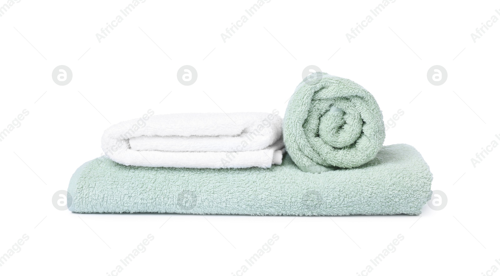 Many folded terry towels isolated on white Photo of Many folded terry towels isolated on white