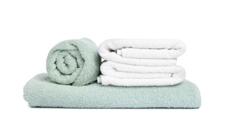 Photo of Many folded terry towels isolated on white