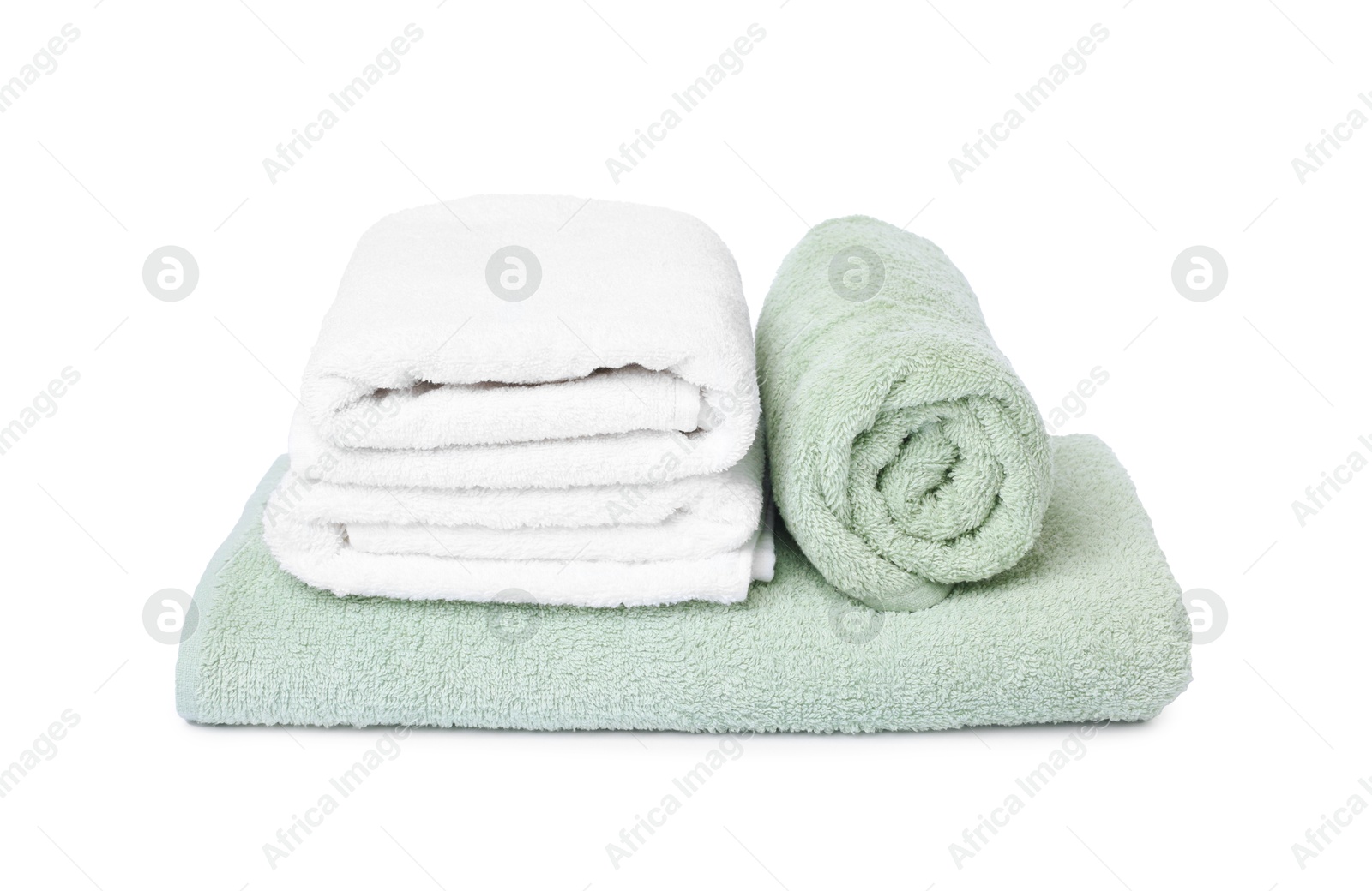 Many folded terry towels isolated on white Photo of Many folded terry towels isolated on white