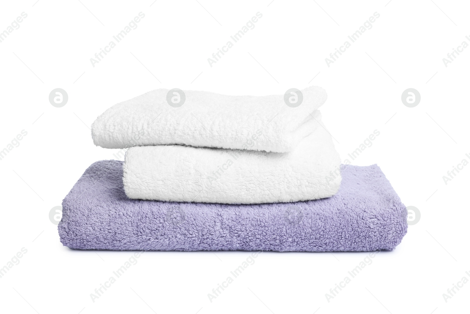 Many folded terry towels isolated on white Photo of Many folded terry towels isolated on white