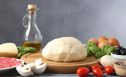 Photo of Making pizza. Different ingredients on gray table
