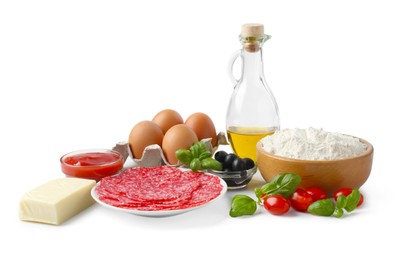 Photo of Making pizza. Different ingredients isolated on white