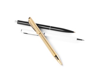Photo of Stylish pens isolated on white, above view