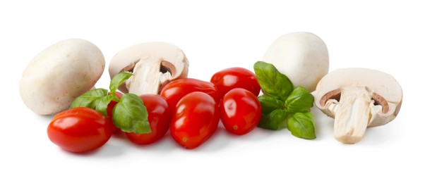 Photo of Fresh tomatoes, mushrooms and basil for pizza isolated on white