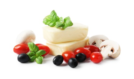 Photo of Making pizza. Different ingredients isolated on white
